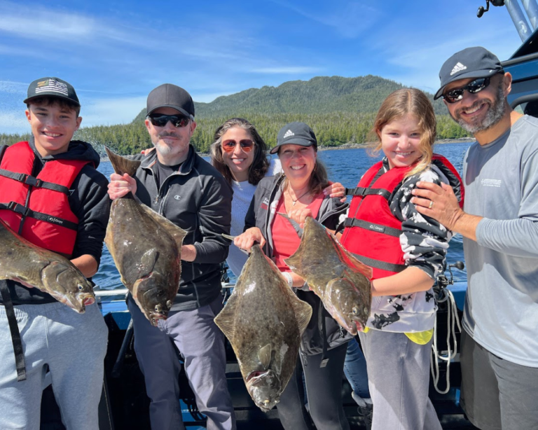 People holding Halibut on a Fishing Charter in Ketchikan Alaska